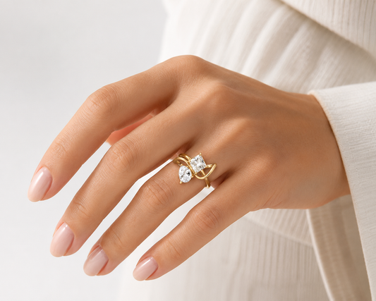 Woman wearing the Rosemere Vivienne crossover gold ring, everyday styling