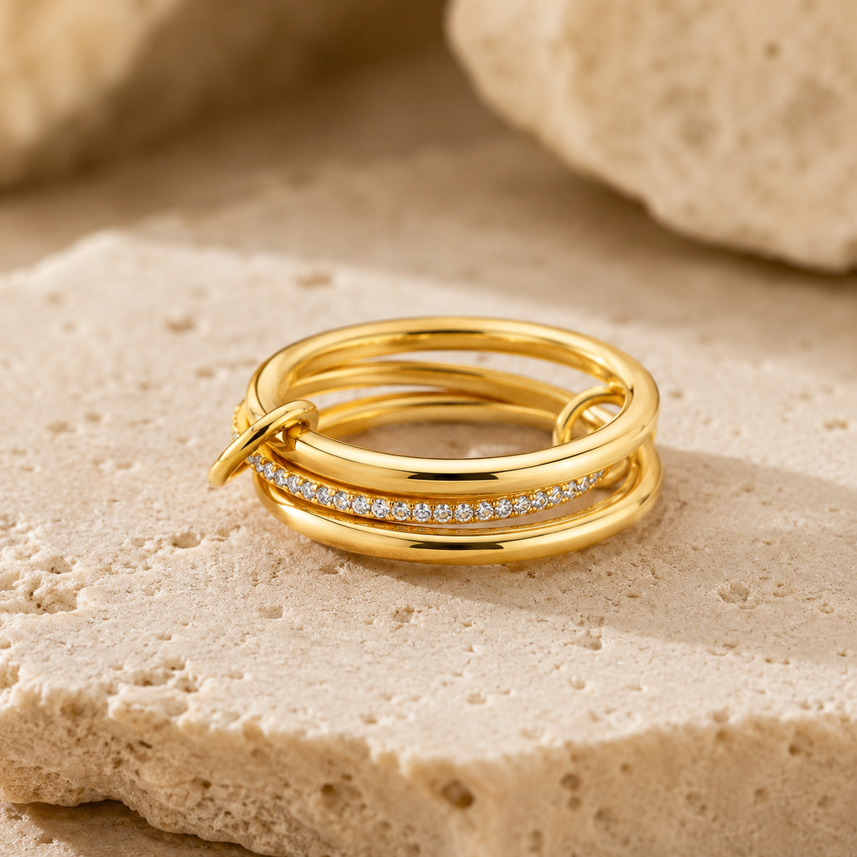 Rosemere Elowen stacked gold ring on natural stone, showing pavé crystal band