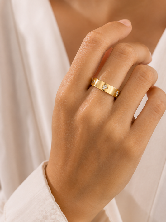 Woman wearing the Rosemere Eloise gold band ring, everyday styling