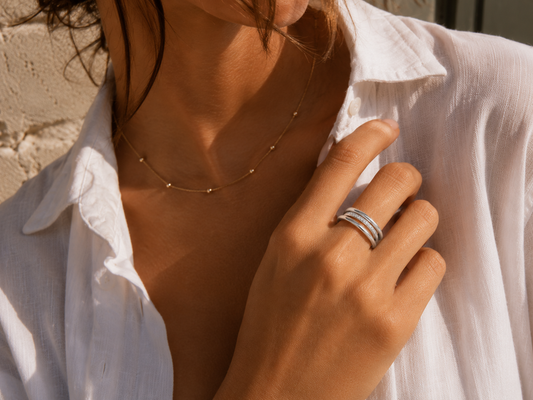 Woman wearing the Rosemere Aeryn silver linked ring, everyday styling