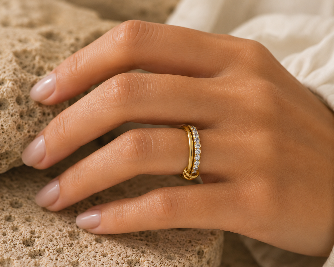 Woman wearing the Rosemere Soraya twisted double gold ring, everyday styling
