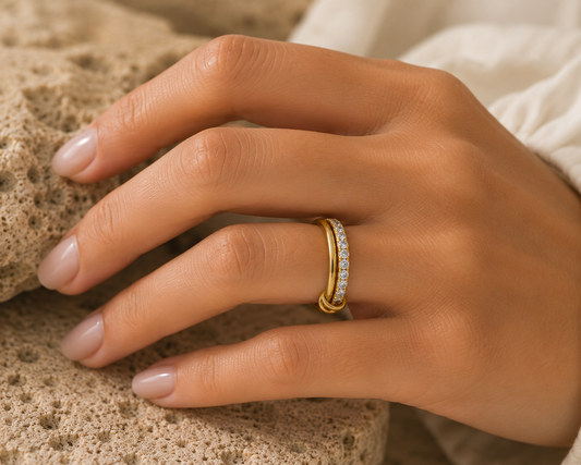 Woman wearing the Rosemere Soraya twisted double gold ring, everyday styling