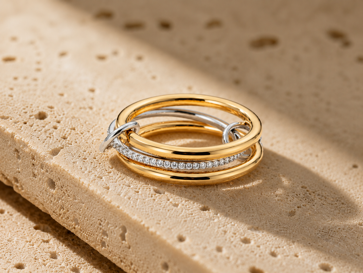 Rosemere Amélie two-tone gold and silver ring on natural stone in soft daylight
