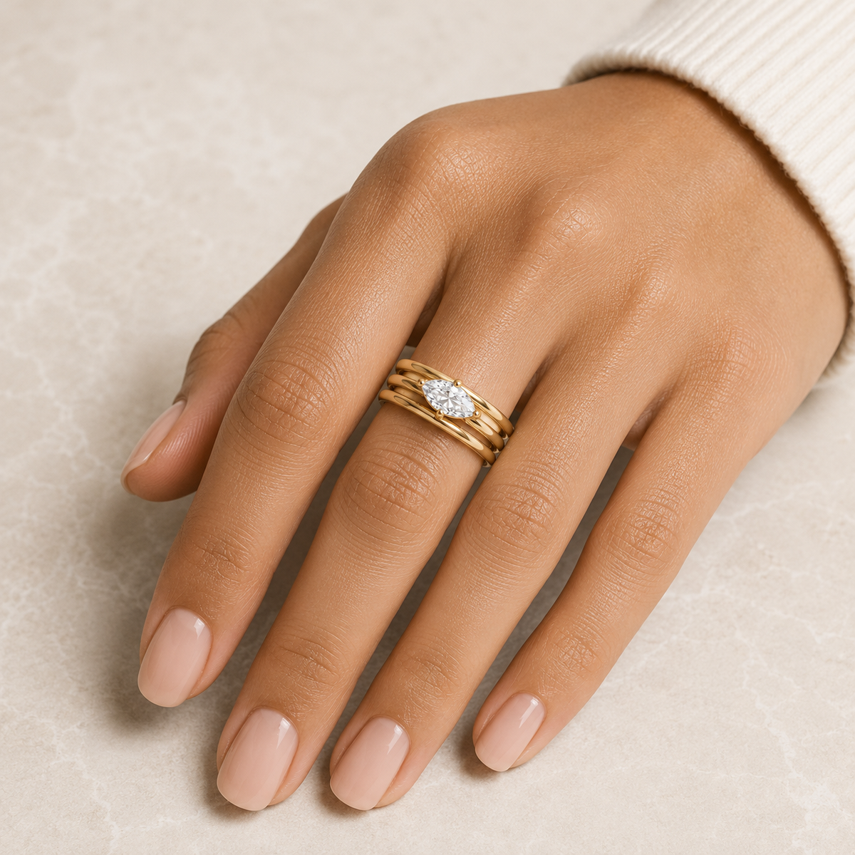 Woman wearing the Rosemere Lucienne stacked gold ring, everyday styling