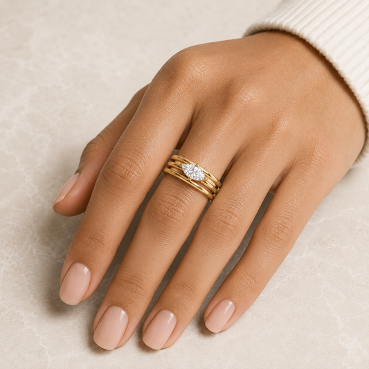 Woman wearing the Rosemere Lucienne stacked gold ring, everyday styling