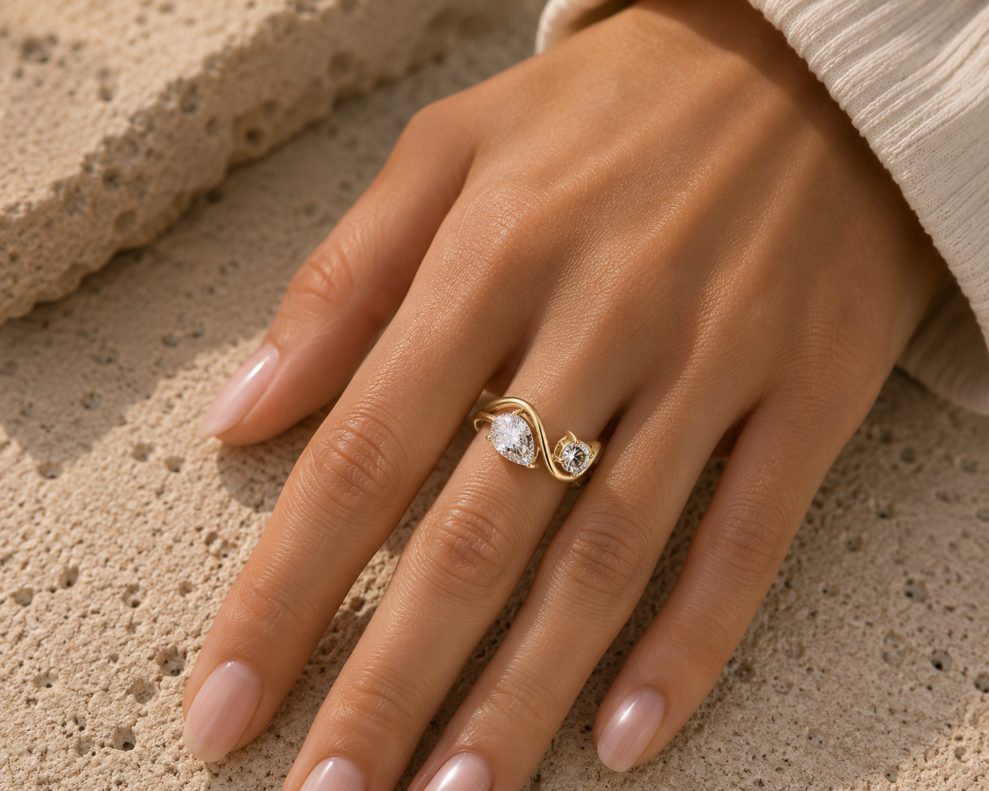 Woman wearing the Rosemere Orielle twin-stone gold ring, everyday styling