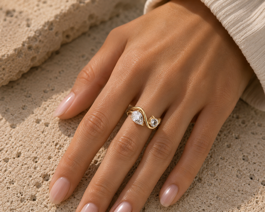 Woman wearing the Rosemere Orielle twin-stone gold ring, everyday styling