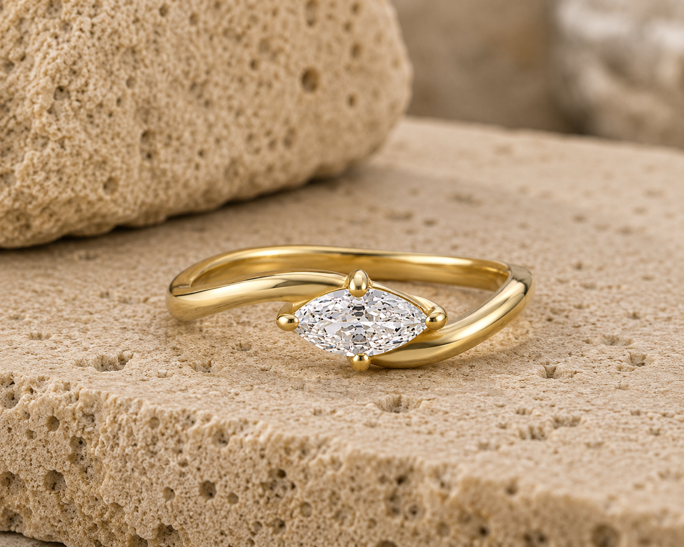 Rosemere Selene marquise-cut gold ring on natural stone in soft daylight