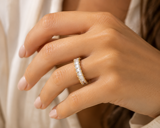 Woman wearing the Rosemere Seraphine gold eternity ring, everyday styling