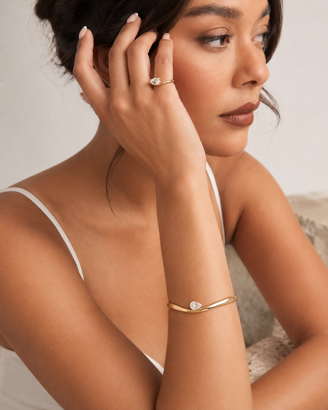 Woman wearing the Rosemere Vivienne gold cuff bangle, everyday styling